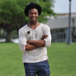 Smiling student standing on campus